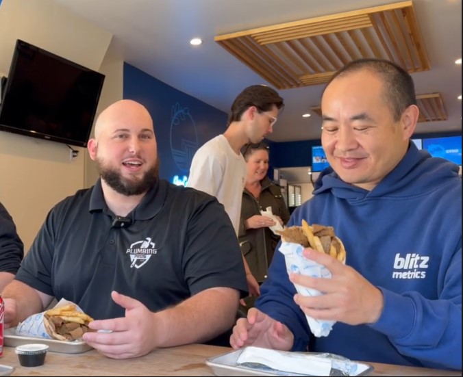 Sal and Dennis having lunch at a Greek Restaurant.