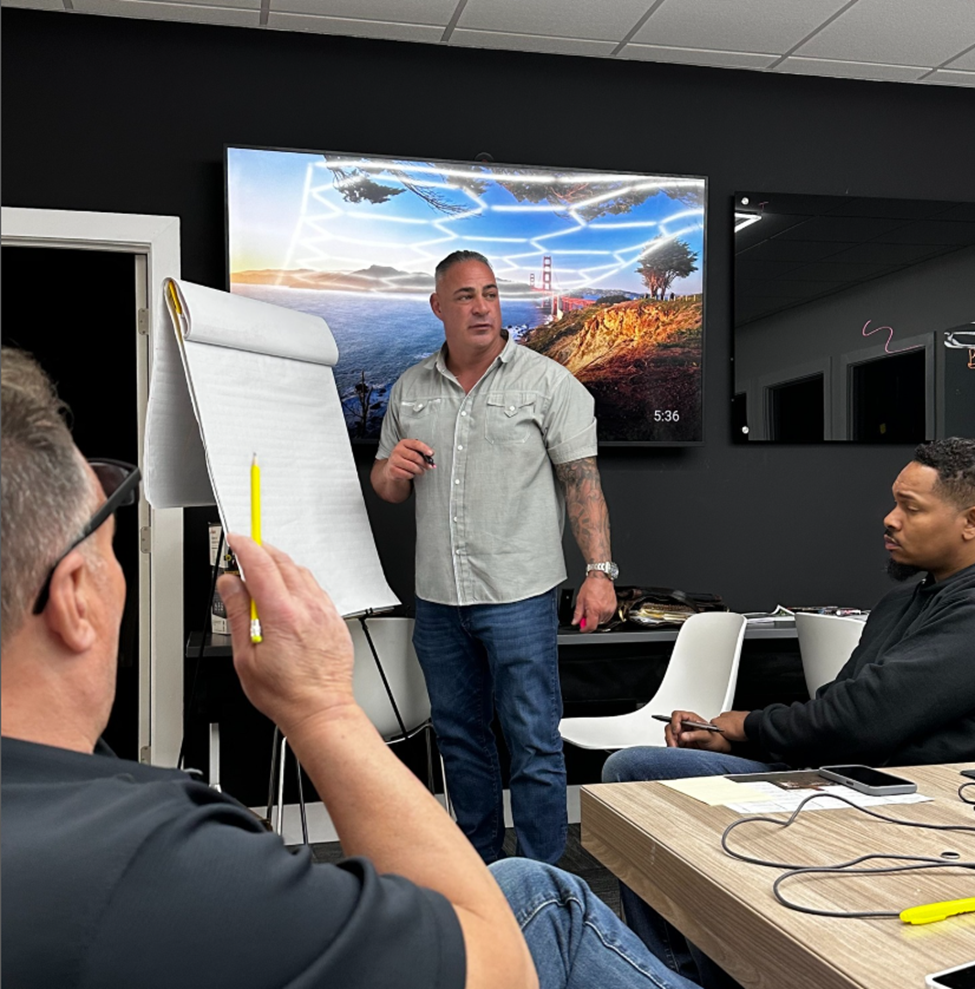 Sam DeMaio working on project ideation with his team