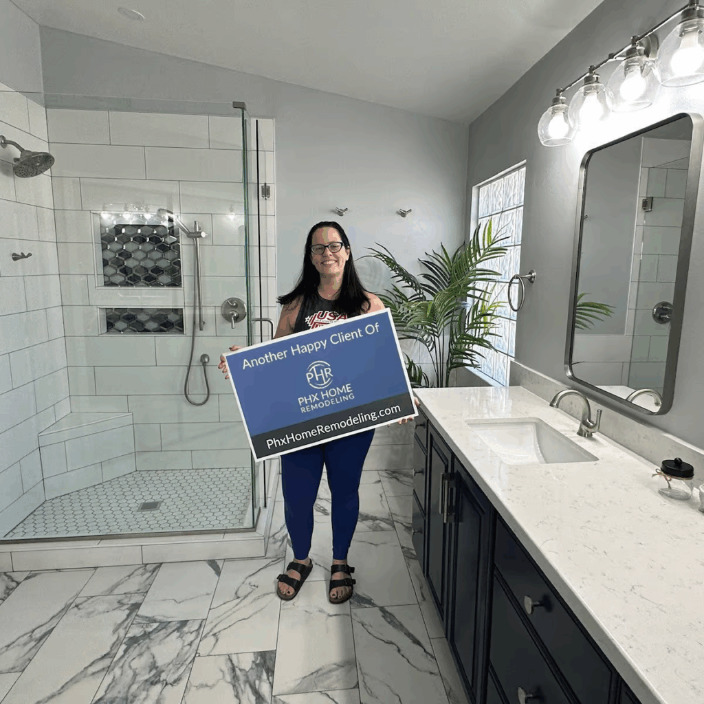 A homeowner stands in her newly renovated bathroom