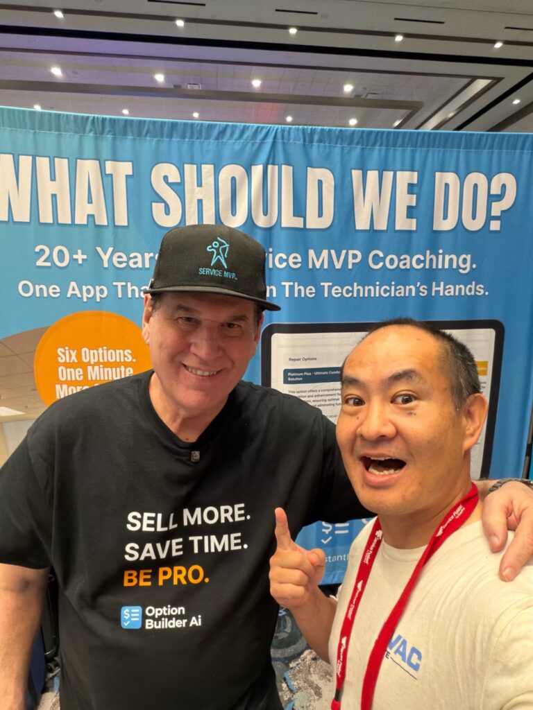 Dennis Yu and Joe Crisara at ServiceWorld conference booth