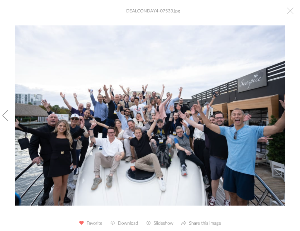 DealCon 2026 group photo on chartered yacht in Miami