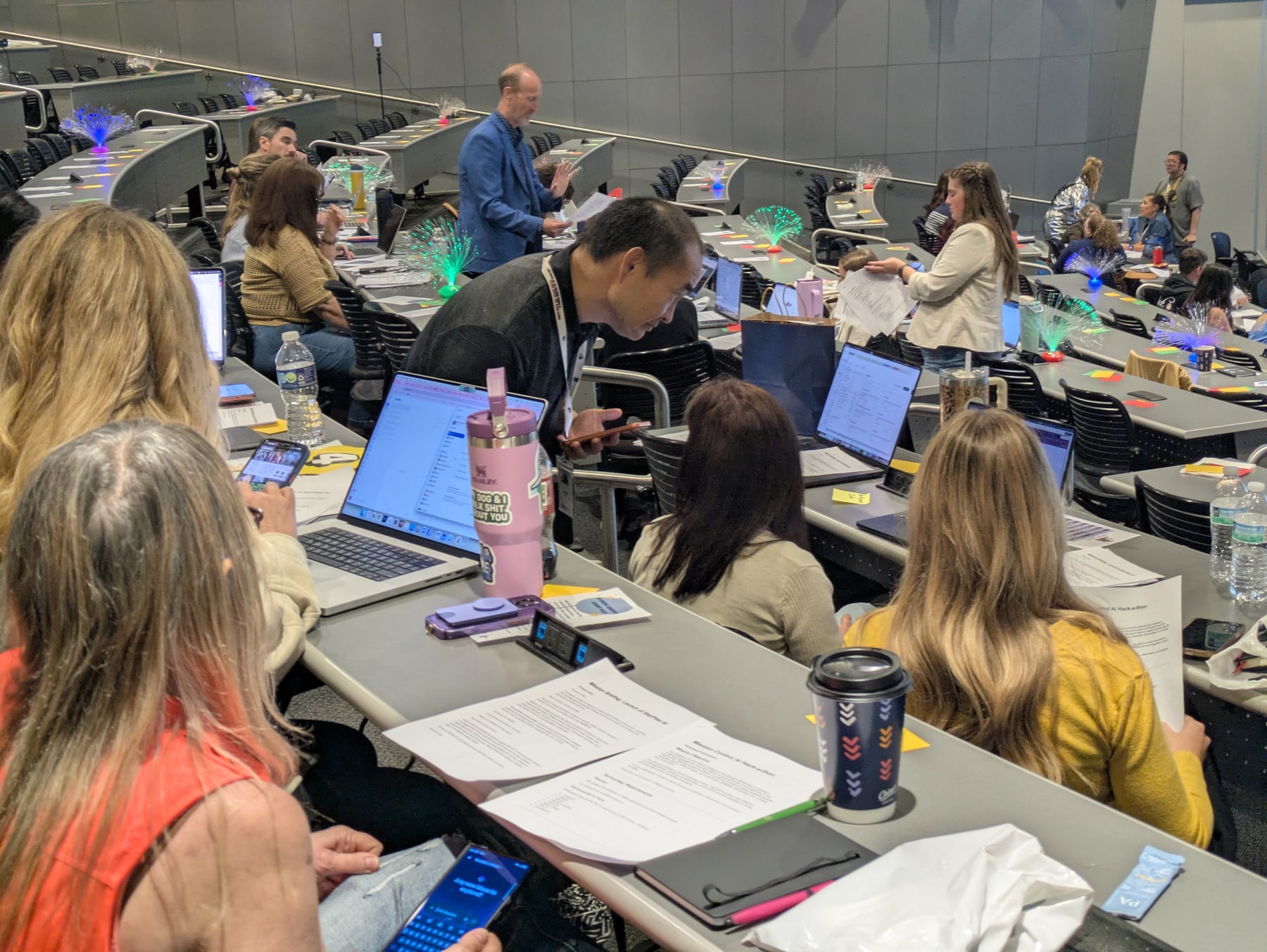 Dennis Yu coaching attendees at laptops during the Digital Wichita summit.